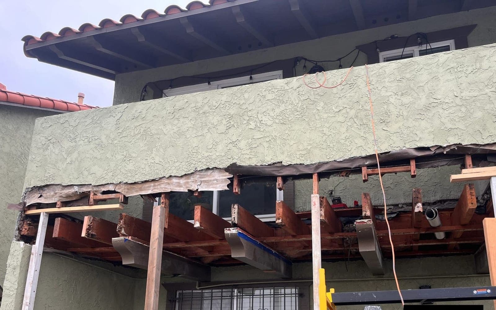 Open balcony framing during an All World Construction repair project